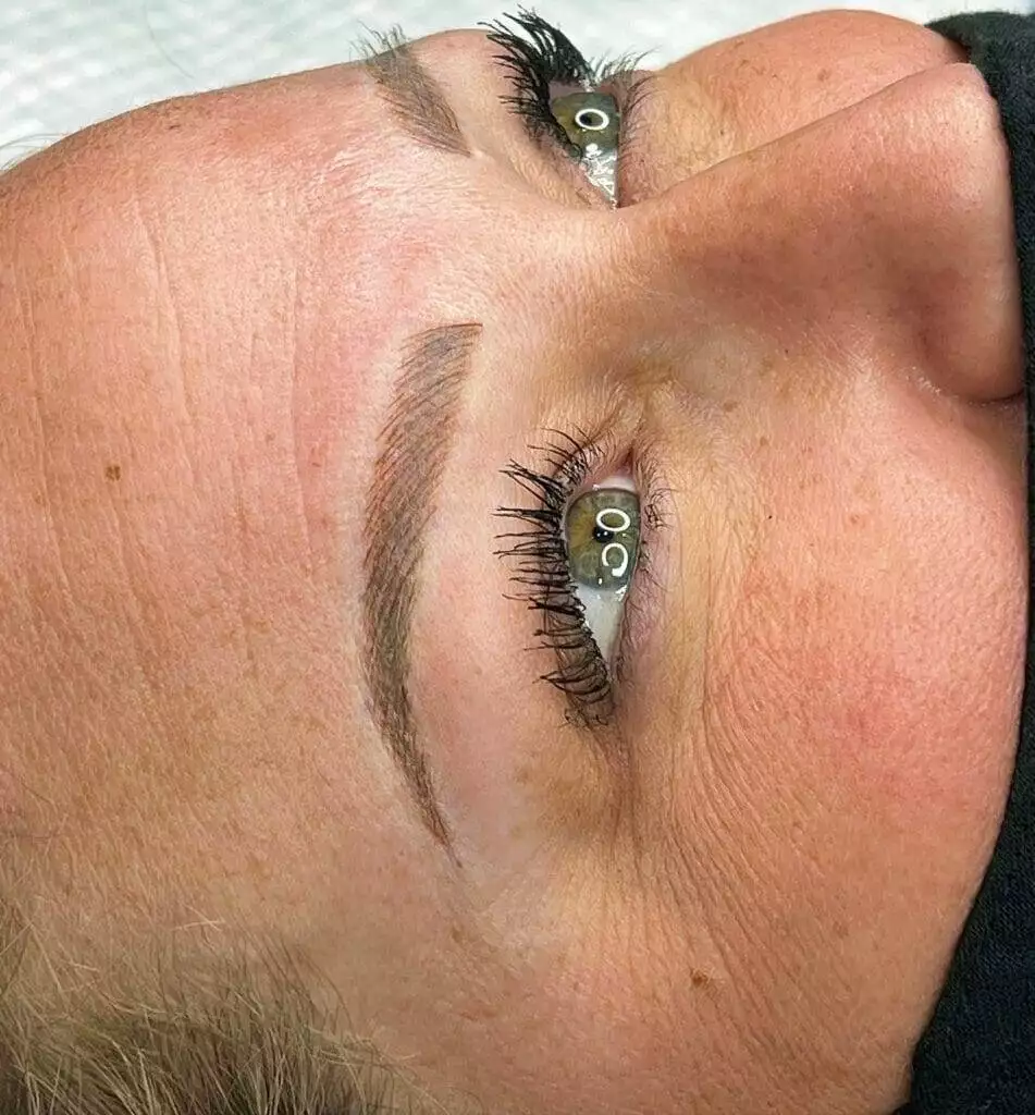 A woman's eyebrows and eyelashes in a salon, Christine Reynolds.