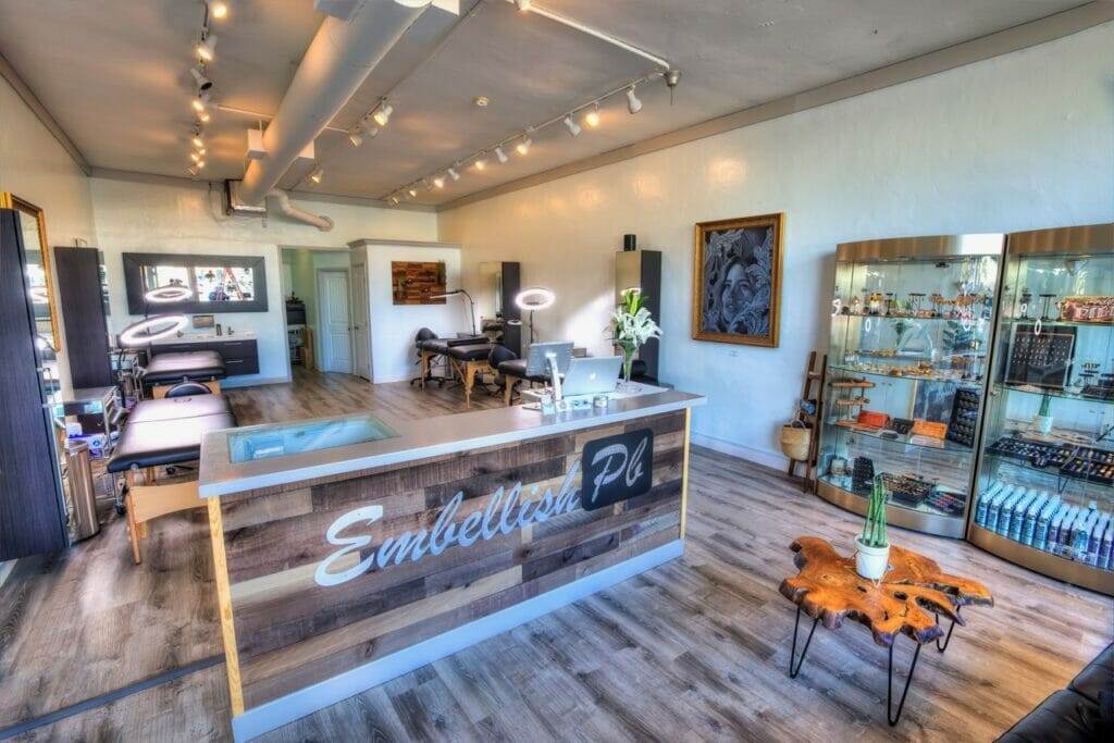 The interior of a home hair salon with a wooden counter.