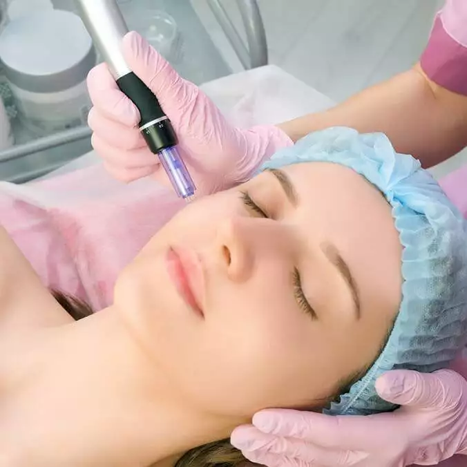 A woman receiving a facial treatment at her home.