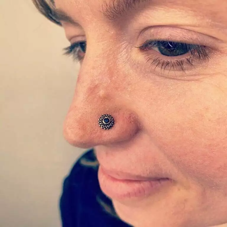 A close up of a woman with a nose piercing named Steve.