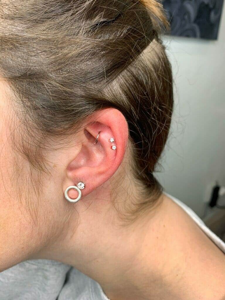 A woman with a piercing on her ear, named Steve.