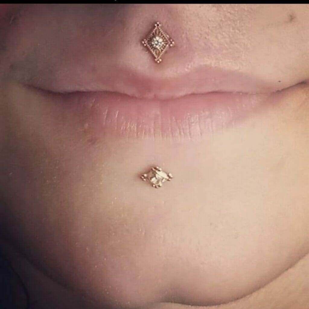 A close up of a woman's nose with a Nathan Atoui diamond piercing.